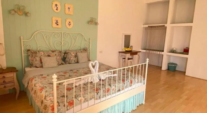 Bed in Rak Na Suan Pueng Resort