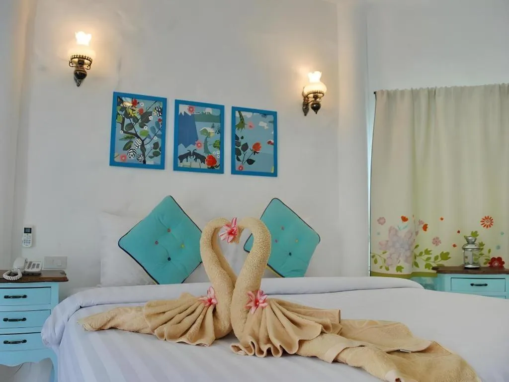 Bed in Rak Na Suan Pueng Resort