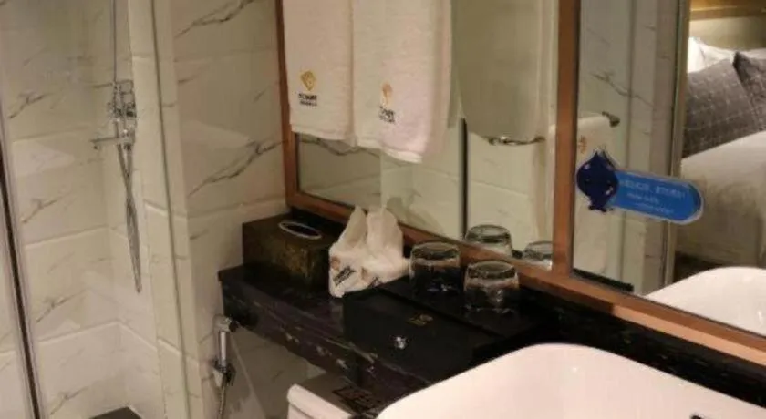 Bed in ST. MORITZ BUSINESS HOTEL