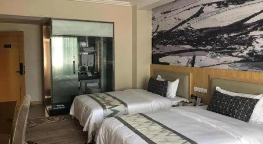 Bed in ST. MORITZ BUSINESS HOTEL