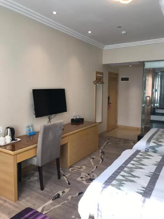 Bed in ST. MORITZ BUSINESS HOTEL