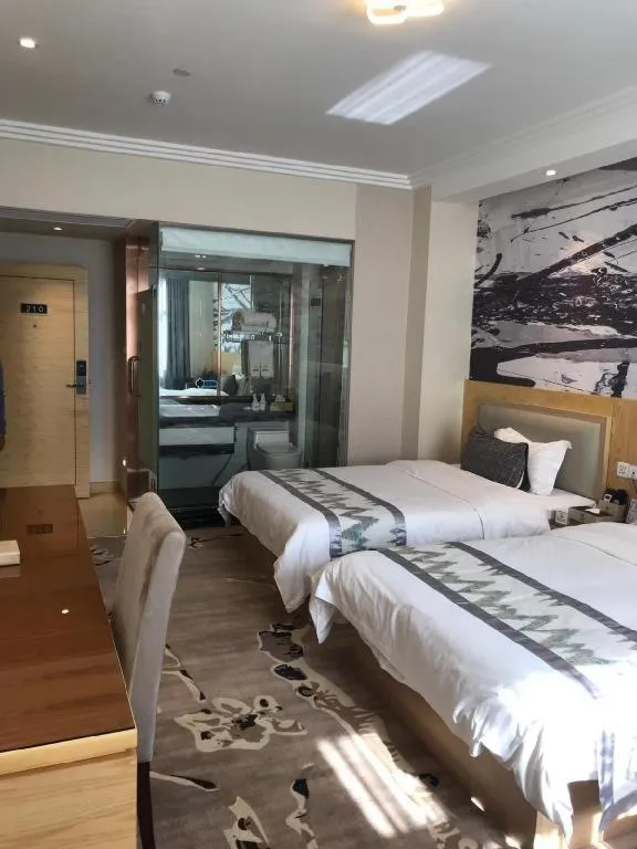 Bed in ST. MORITZ BUSINESS HOTEL