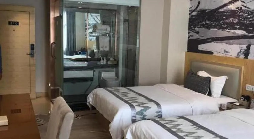 Bed in ST. MORITZ BUSINESS HOTEL