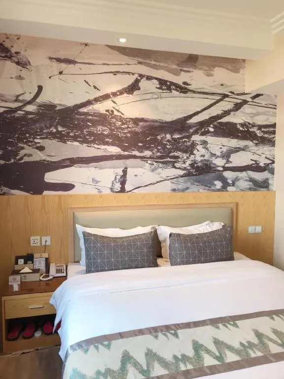 Bed in ST. MORITZ BUSINESS HOTEL