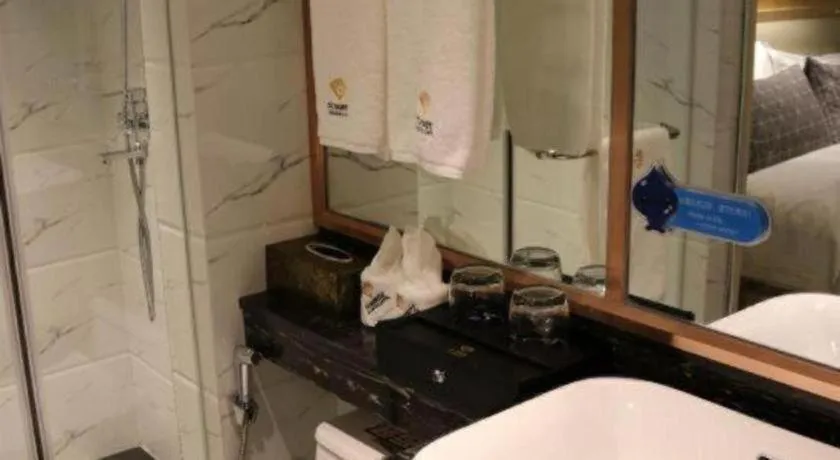 Bed in ST. MORITZ BUSINESS HOTEL