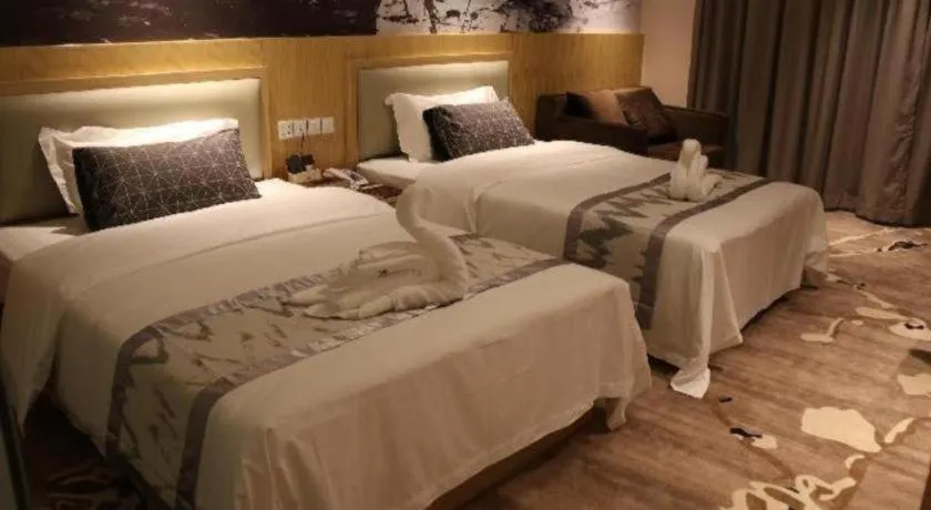 Bed in ST. MORITZ BUSINESS HOTEL