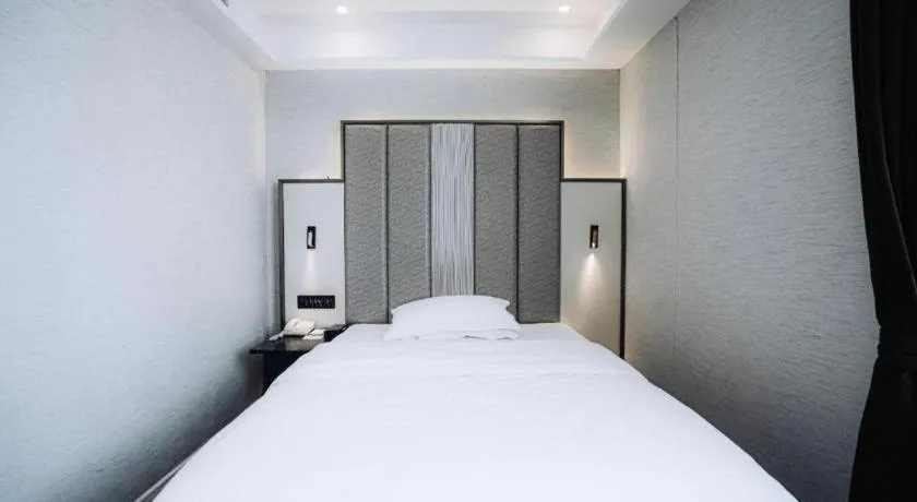 Bed in Jinjiang Metropolo Hotel Nanjing Jiangning Binjiang Development Zone