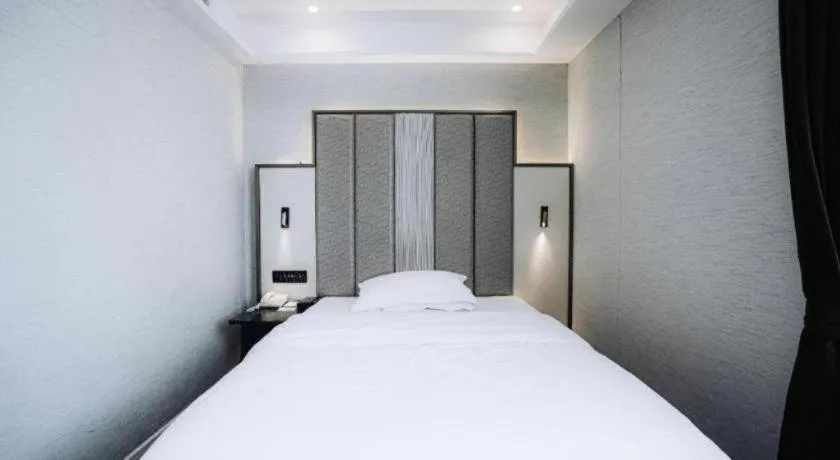 Bed in Jinjiang Metropolo Hotel Nanjing Jiangning Binjiang Development Zone