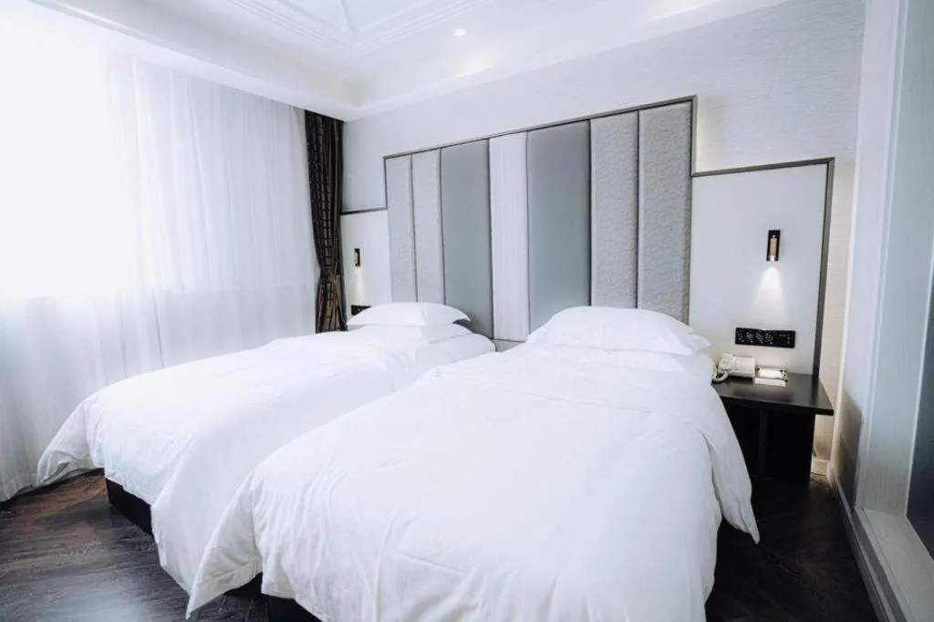 Bed in Jinjiang Metropolo Hotel Nanjing Jiangning Binjiang Development Zone