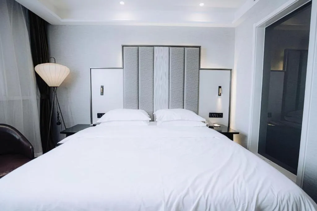 Bed in Jinjiang Metropolo Hotel Nanjing Jiangning Binjiang Development Zone