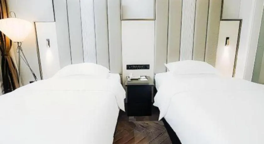 Bed in Jinjiang Metropolo Hotel Nanjing Jiangning Binjiang Development Zone