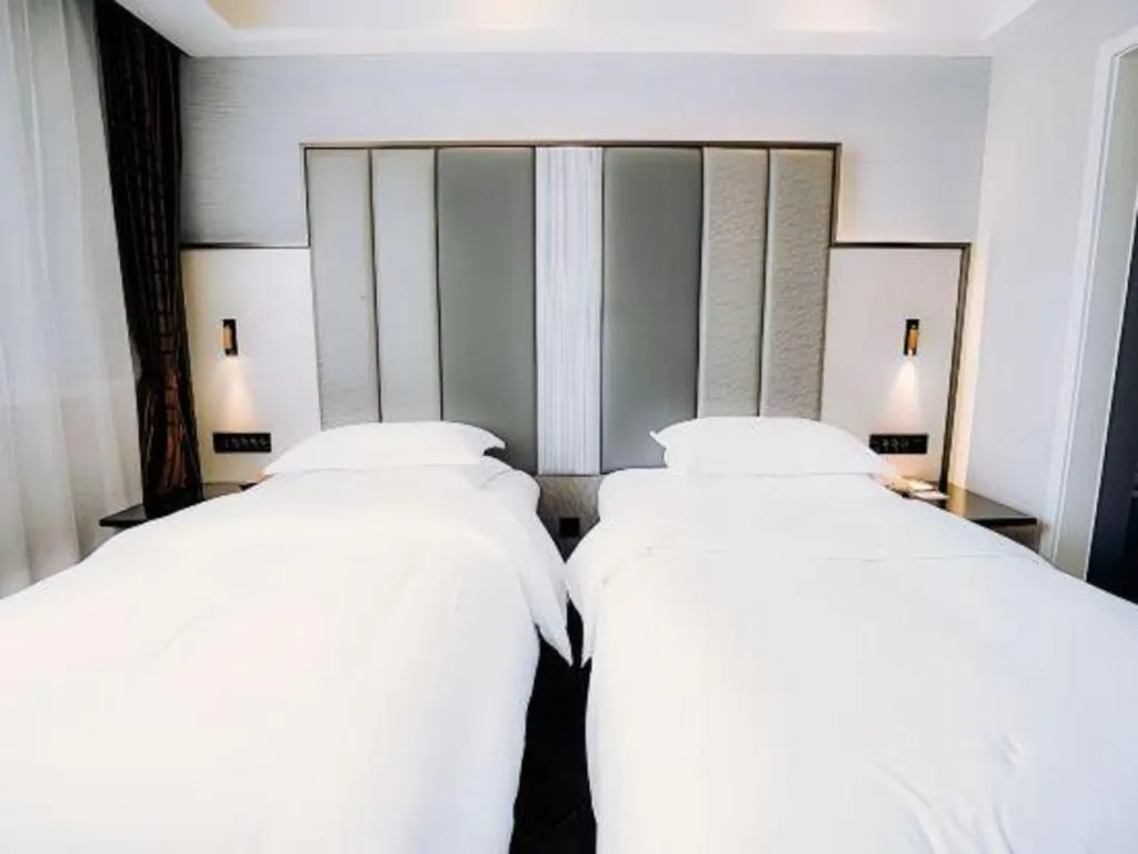 Bed in Jinjiang Metropolo Hotel Nanjing Jiangning Binjiang Development Zone
