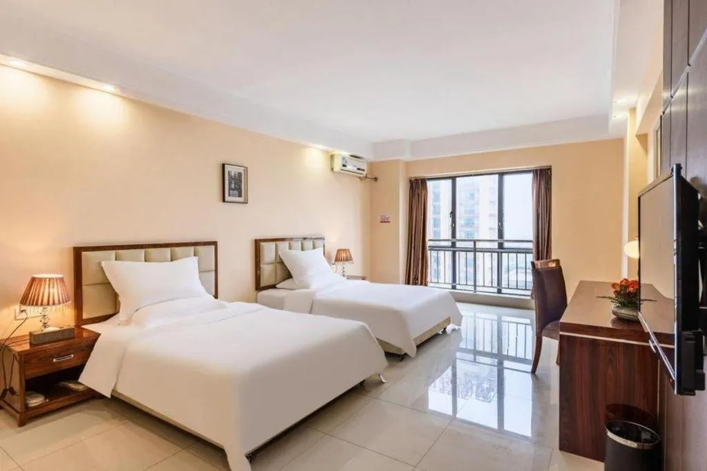 Bed in Foshan Baolong Hotel