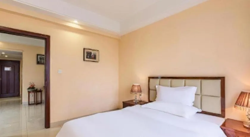 Bed in Foshan Baolong Hotel