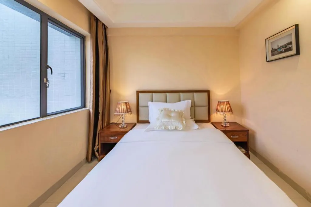 Bed in Foshan Baolong Hotel