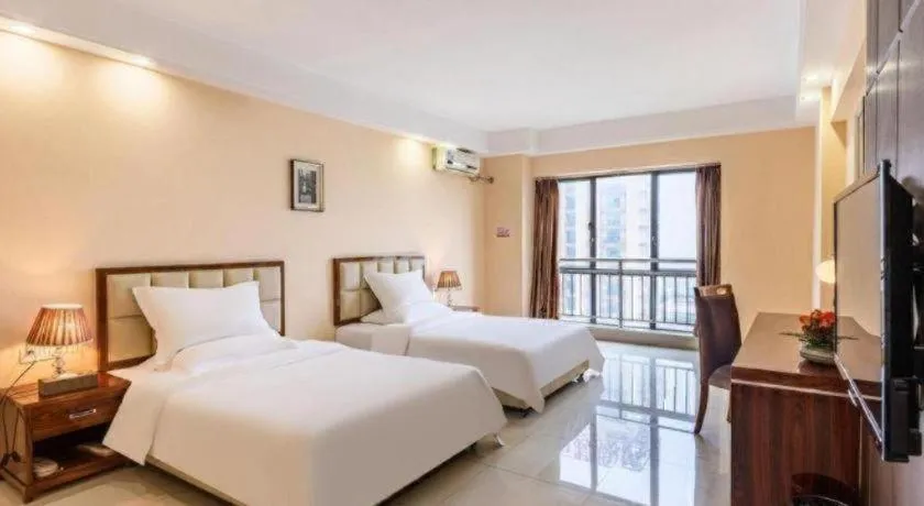 Bed in Foshan Baolong Hotel