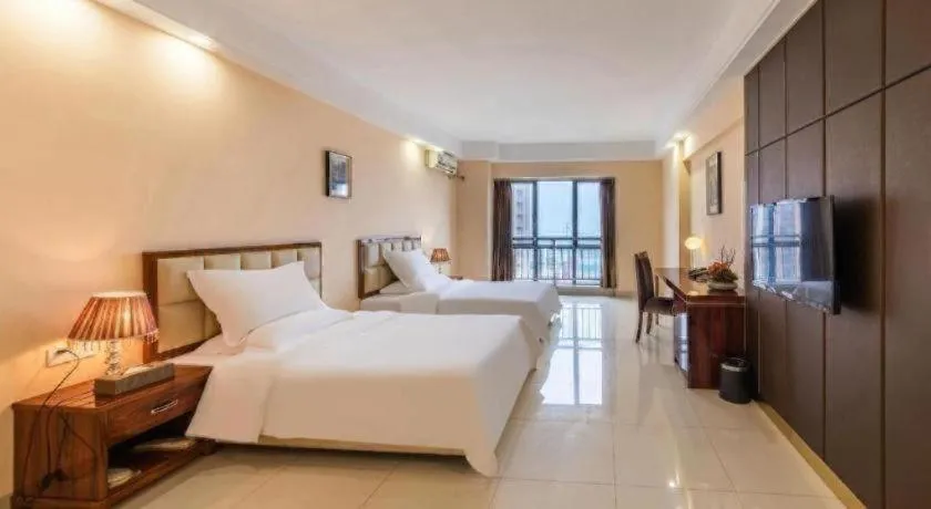 Bed in Foshan Baolong Hotel