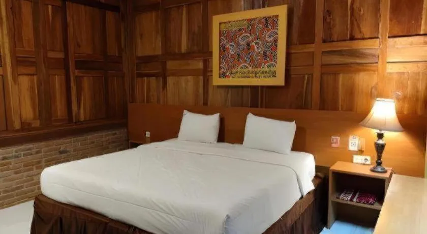 Bed in Parai Beach Resort Telengria