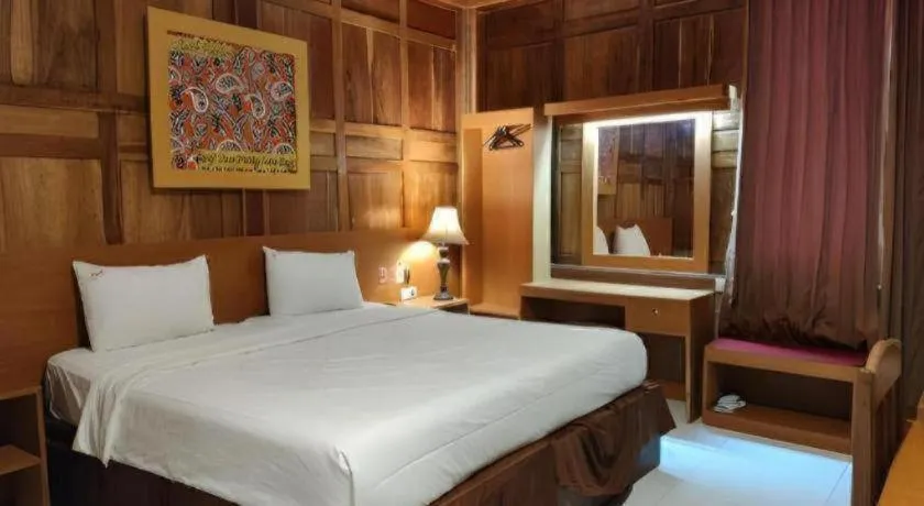 Bed in Parai Beach Resort Telengria
