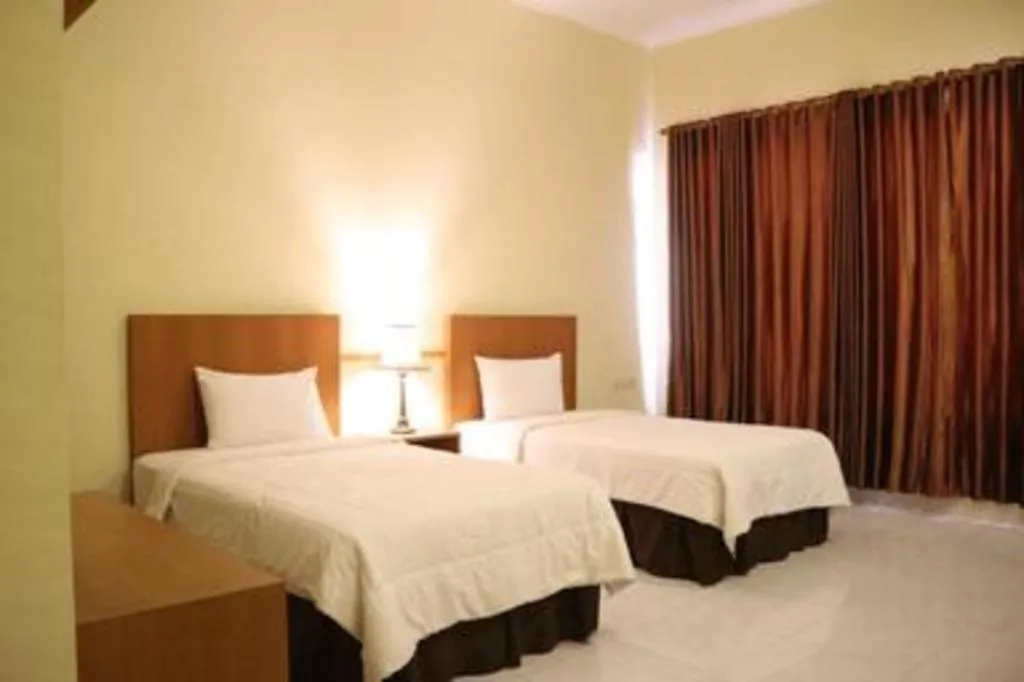 Bed in Parai Beach Resort Telengria