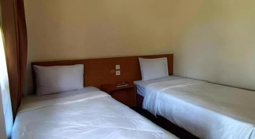 Bed in Parai Beach Resort Telengria