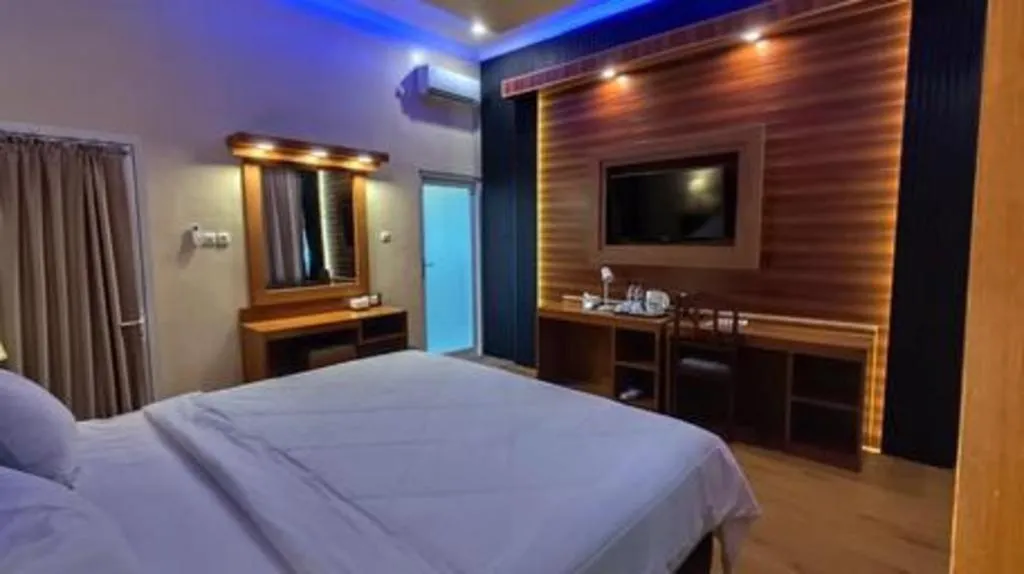 Bed in Parai Beach Resort Telengria