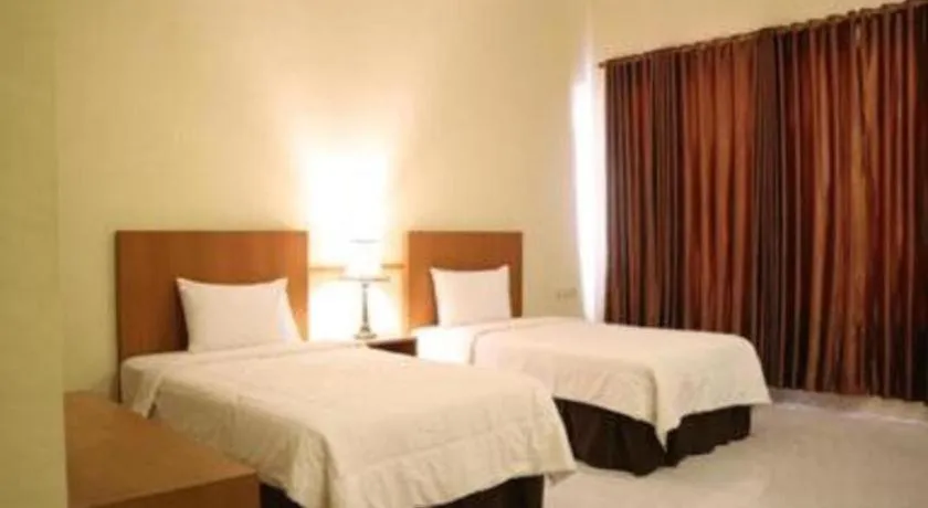 Bed in Parai Beach Resort Telengria