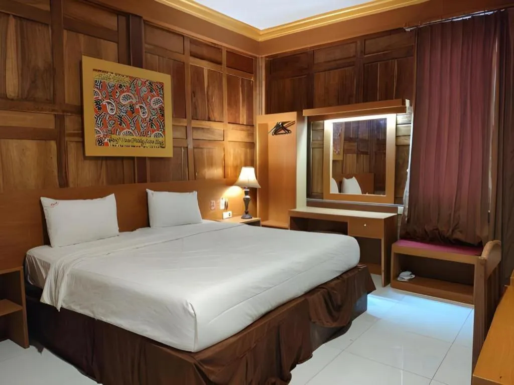 Bed in Parai Beach Resort Telengria