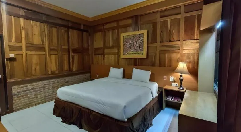 Bed in Parai Beach Resort Telengria