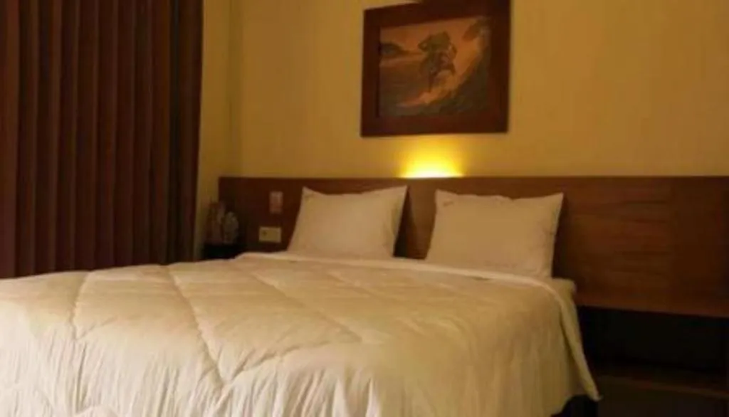 Bed in Parai Beach Resort Telengria