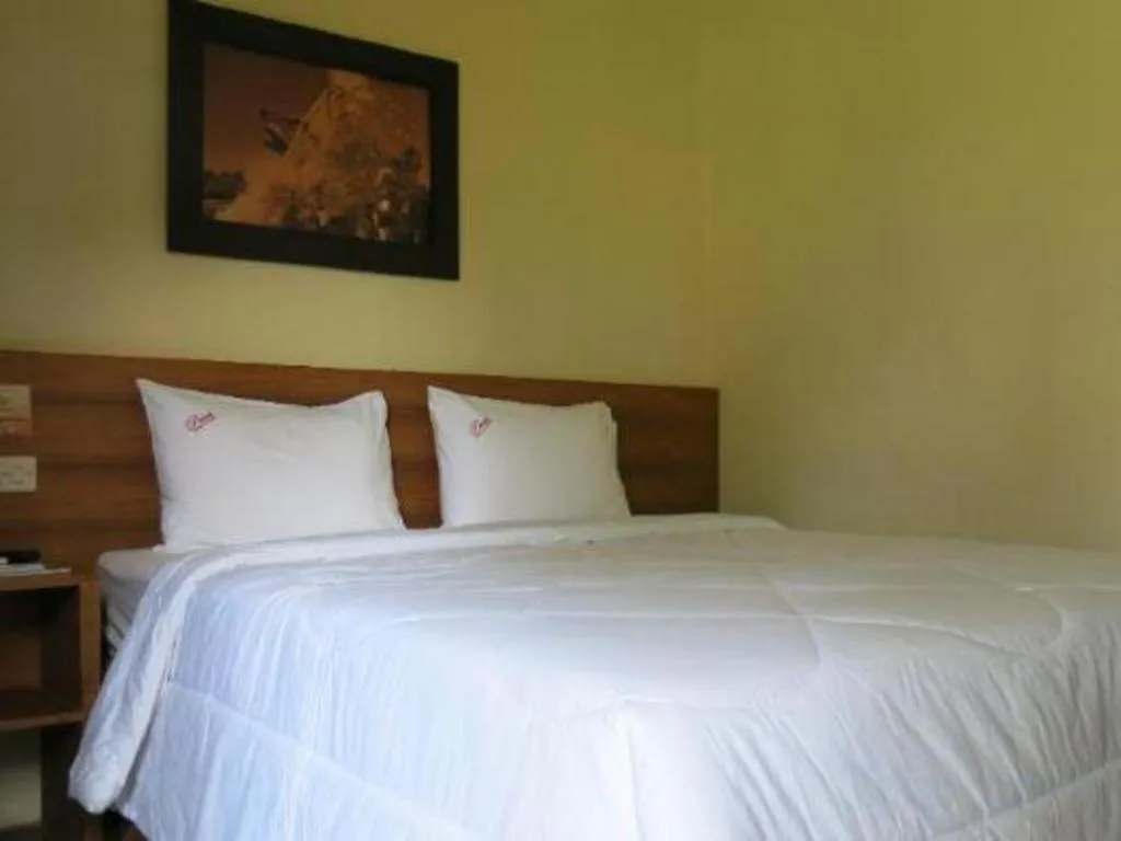 Bed in Parai Beach Resort Telengria