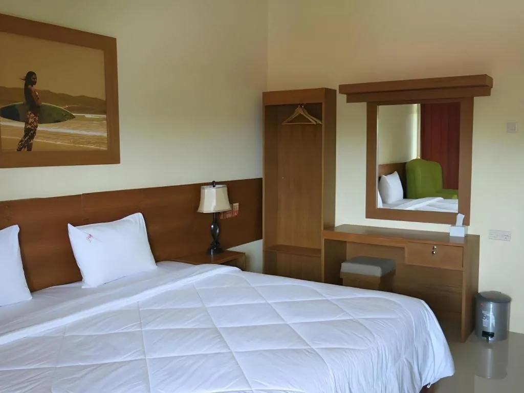 Bed in Parai Beach Resort Telengria