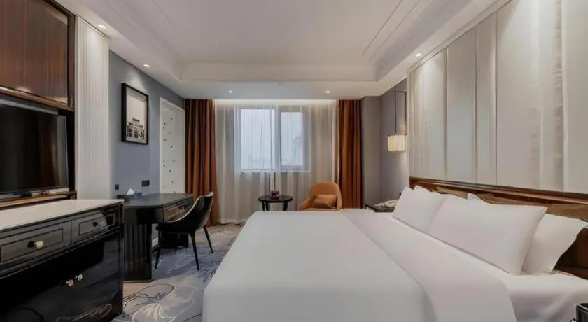 Bed in Jinjiang Metropolo Hotel Nanjing Confucius Temple Branch