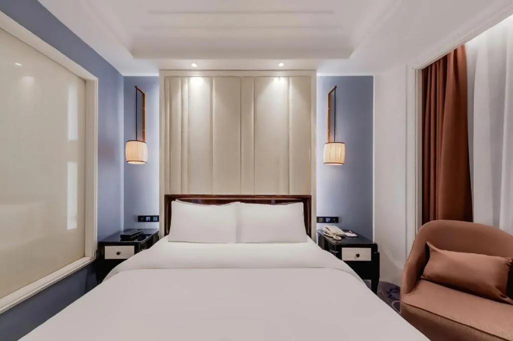 Bed in Jinjiang Metropolo Hotel Nanjing Confucius Temple Branch