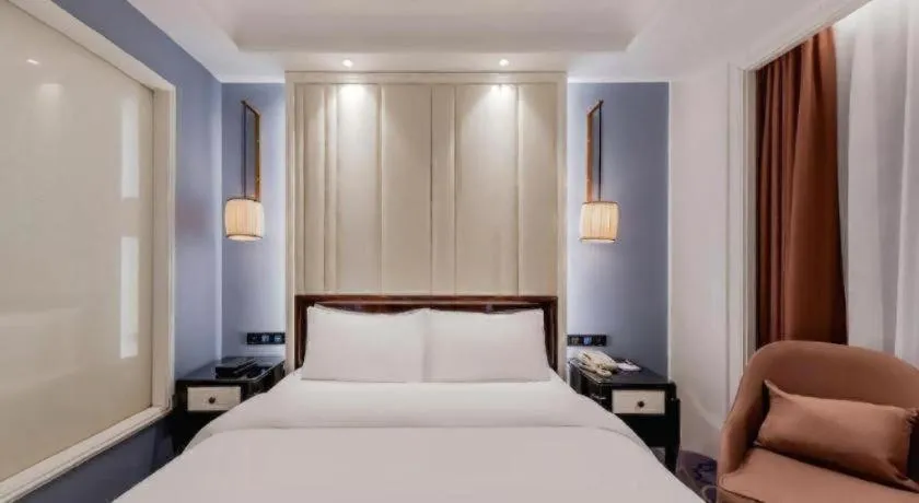 Bed in Jinjiang Metropolo Hotel Nanjing Confucius Temple Branch