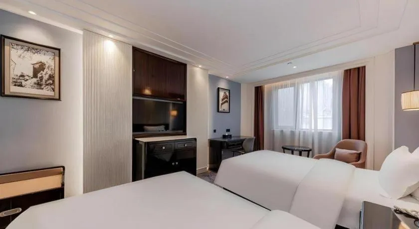 Bed in Jinjiang Metropolo Hotel Nanjing Confucius Temple Branch