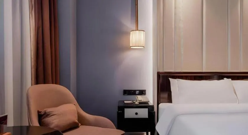 Bed in Jinjiang Metropolo Hotel Nanjing Confucius Temple Branch