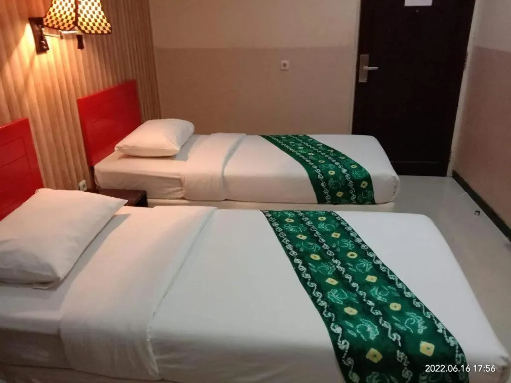 Bed in Queen City Hotel