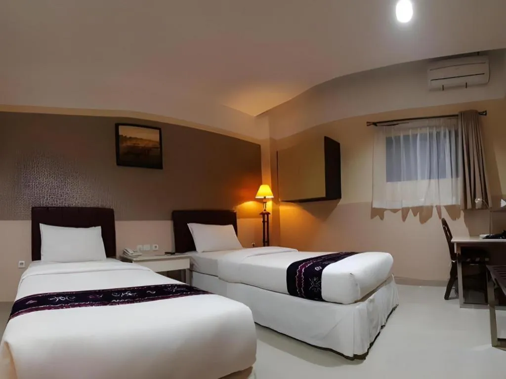 Bed in Queen City Hotel