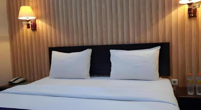 Bed in Queen City Hotel