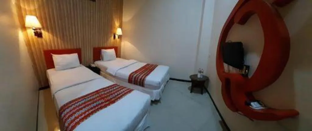 Bed in Queen City Hotel