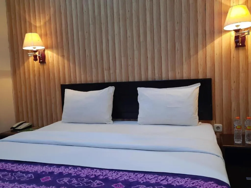 Bed in Queen City Hotel