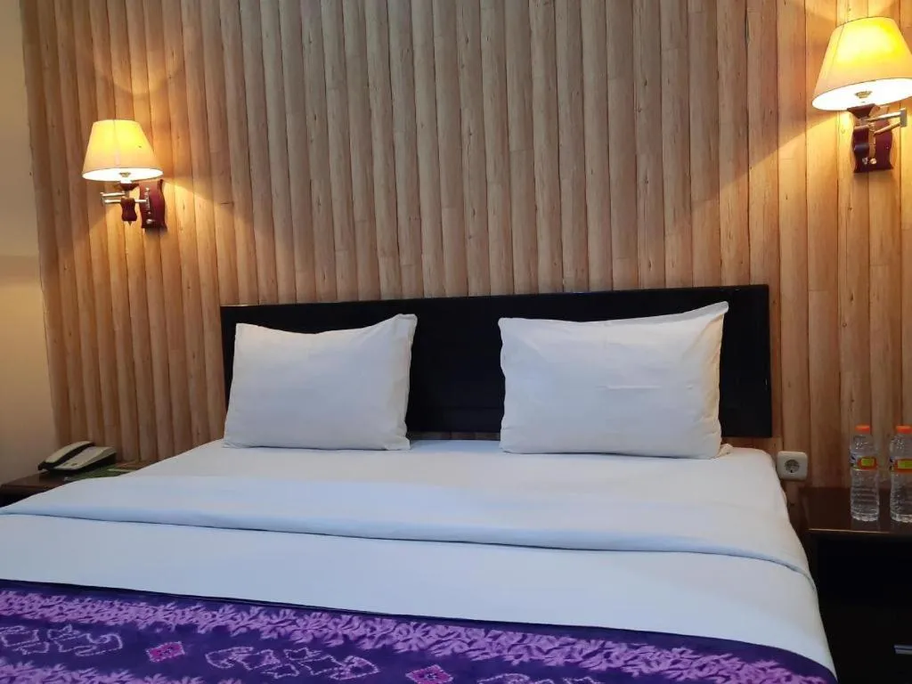 Bed in Queen City Hotel