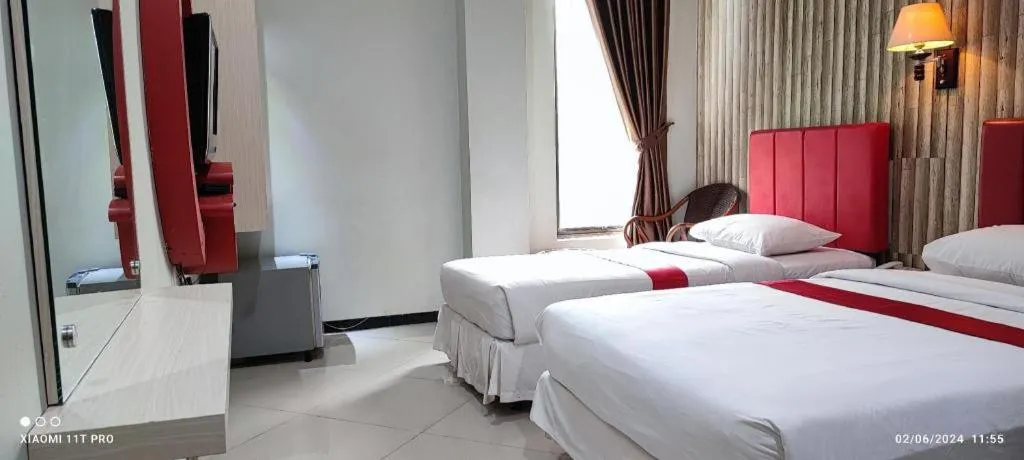 Bed in Queen City Hotel