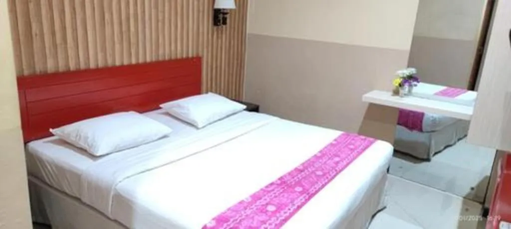 Bed in Queen City Hotel