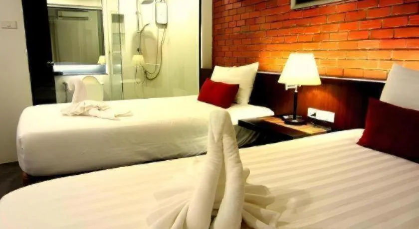 Bed in De Aerng Boutique Hotel