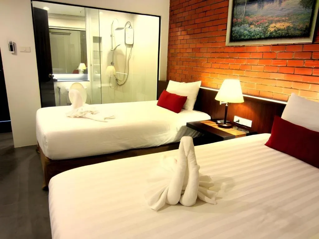 Bed in De Aerng Boutique Hotel