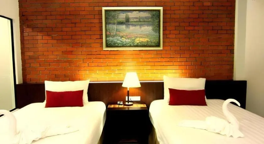 Bed in De Aerng Boutique Hotel