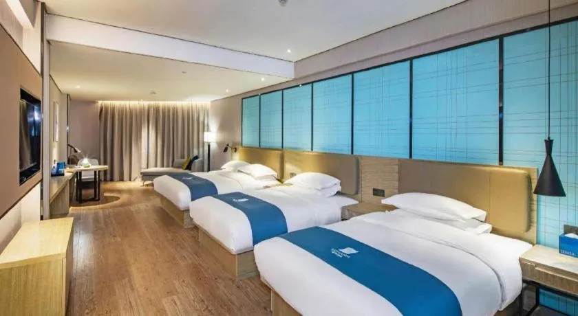 Bed in Echarm Hotel Guilin North High Speed Railway Station