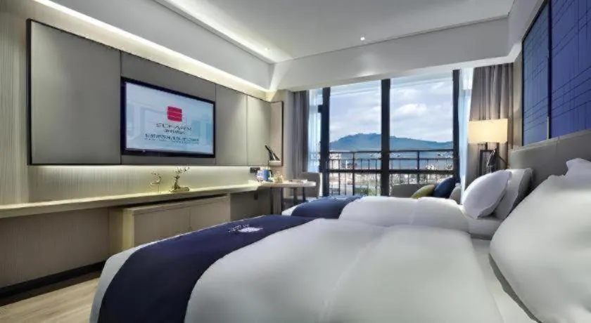 Bed in Echarm Hotel Guilin North High Speed Railway Station